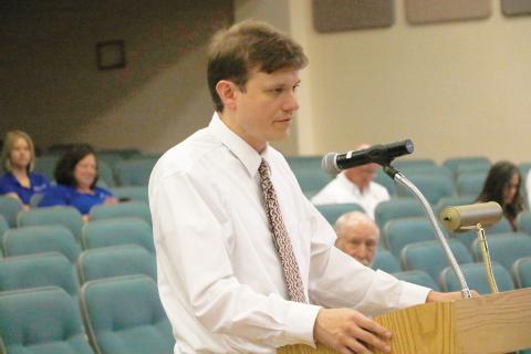 Staz Guntek, Columbia County’s legislative and intergovernmental affairs coordinator, updates the Columbia County Commission on the state budget talks Thursday. (JAMIE WACHTER/Lake City Reporter)