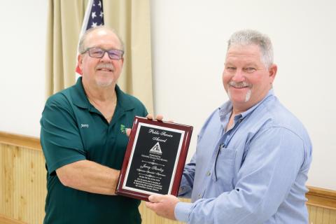 Jerry Stanley (left) was honored with the Public Service Award at the Columbia County Farm Bureau public officials appreciation dinner Monday night. Stanley is presented his plaque by Clint Pittman. (TONY BRITT/Lake City Reporter)