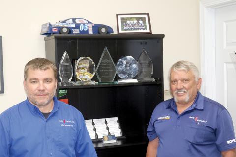 Donald Hollingsworth (right) opened up Holly Electric 30 years ago with help from his family. His son, Donald II (left), is now an equal partner in the Lake City-based business. (TONY BRITT/Lake City Reporter)