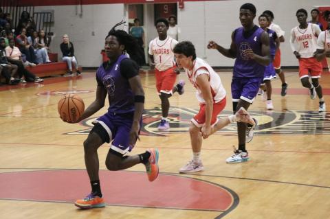 Columbia guard Kadrian Wilson drives to the basket on a fast break against Santa Fe on Tuesday. (JORDAN KROEGER/Lake City Reporter)