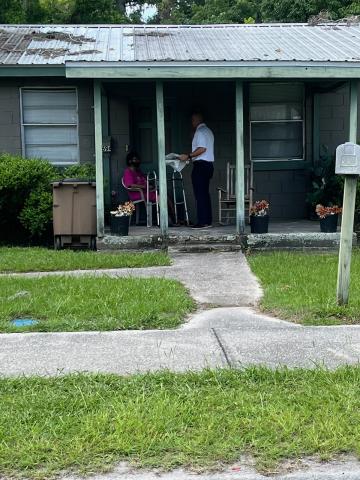 Lake City Assistant Fire Chief Ret Tompkins stops at a residence Tuesday to help install smoke detectors and provide disaster preparedness information. (COURTESY LAKE CITY FIRE DEPARTMENT)