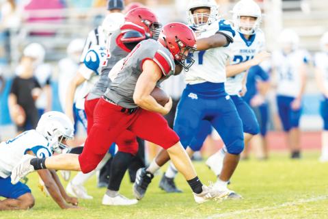 Lafayette running back Dayne McCray gains a chunk of yardage against Keystone Heights during their spring jamboree on May 20. (JACK HOWDESHELL/Lake City Reporter)