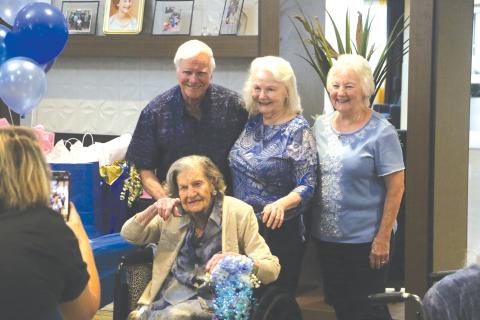 Ed Higgins (back row from left), Andra Higgins and Sharron O’Quinn join with Mary Higgins for her 106th birthday party. (MORGAN MCMULLEN/Lake City Reporter)