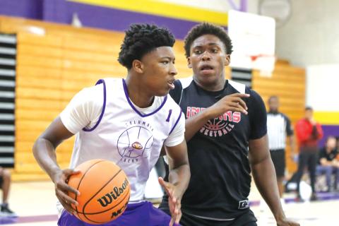 Columbia guard Shaheed White makes a move in the paint Thursday against Fort White in the two teams’ summer league finale. (BRENT KUYKENDALL/Lake City Reporter)