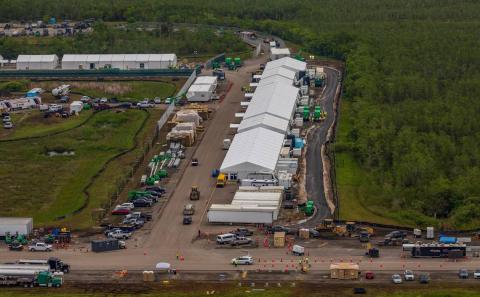 Aerial view of structures including gigantic tents built at the recently opened migrant detention center, Alligator Alcatraz, located at the site of the Dade-Collier Training and Transition Airport in Ochopee on Friday. (PEDRO PORTAL/Miami Herald/TNS)