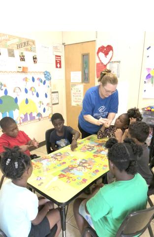 Students at the Boys and Girls Club-Mayo Unit work on making catapults during an after-school program lesson this spring. (COURTESY)