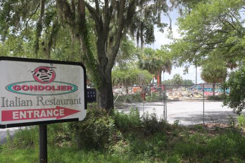 The Gondolier Italian Restaurant and Pizza building was demolished Tuesday afternoon, nearly five years after the restaurant closed in September 2020. (TONY BRITT/Lake City Reporter)