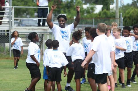 Jaquez Moore gathers campers together during his football camp on Saturday. (PAUL BUCHANAN/Lake City Reporter)