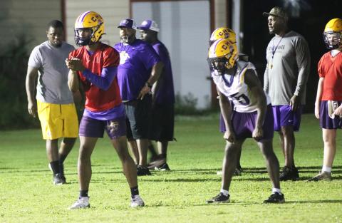 Columbia quarterback Xavier Collins (left) gets set to take a snap alongside running back Jerome Horne during Tuesday's practice. (JORDAN KROEGER/Lake City Reporter)