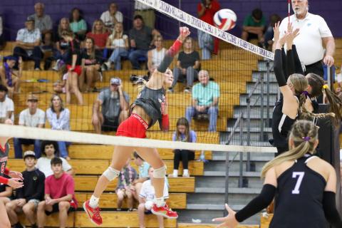 Lafayette outside hitter Kayley Johnson fires a shot over the net against Columbia on Thursday. (BRENT KUYKENDALL/Lake City Reporter)