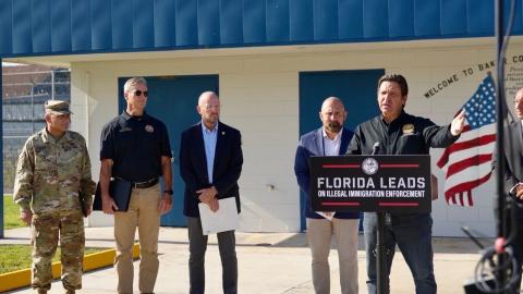 Gov. Ron DeSantis announces the creation of the ‘Deportation Depot’ immigrant detention center at Baker Correctional Institution in Sanderson on Thursday along with other state officials. The state prison’s proximity to the Lake City Gateway Airport was a key component in its selection for the site. (COURTESY)