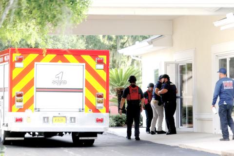 Lake City firefighters and police officers enter the Southside Baptist Church on Tuesday for an active assailant training session. (TONY BRITT/Lake City Reporter)