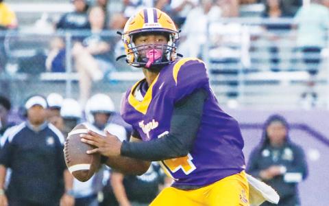 Columbia quarterback Xavier Collins drops back to pass against Oakleaf during the Preseason Classic on Aug. 15. (BRENT KUYKENDALL/Lake City Reporter)