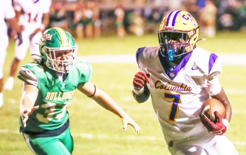 Columbia receiver Kyren Caldwell turns up field after a catch against Suwannee on Friday. (BRENT KUYKENDALL/Lake City Reporter)