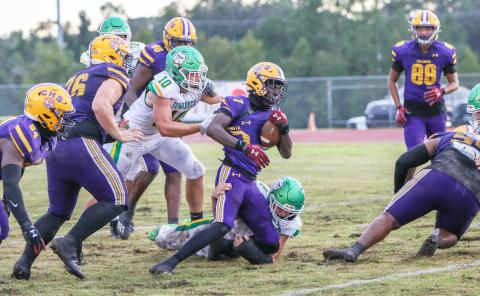 Columbia receiver Kyren Caldwell is tackled from behind during last season’s 13-0 win over Suwannee. (BRENT KUYKENDALL/Lake City Reporter)
