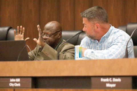 Live Oak City Council President Matt Campbell (right) looks on as County President Pro-Tem Tommie Jefferson speaks Tuesday during a budget workshop about the need for funding to pave streets in his district, including Spruce Street. (JAMIE WACHTER/Lake City Reporter)