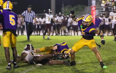 Columbia safety Julian De La Cruz celebrates after making a fourth-down stop to seal Friday’s win over Coffee. (BRENT KUYKENDALL/Lake City Reporter)