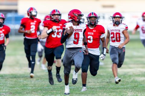 Lafayette quarterback Tywan Williamson (9) heads to the end zone for a touchdown Hornets’ first possession of the game during Friday’s win over Dixie County. (JACK HOWDESHELL/Lake City Reporter)