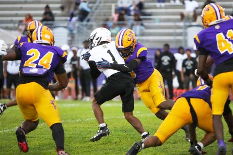Columbia defensive back Von Lane tackles Oakleaf running back Mike Conner during Friday’s Preseason Classic. (BRENT KUYKENDALL/Lake City Reporter)