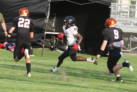 Fort White receiver John’l Lawson runs up field after a catch against Trenton during last week’s Preseason Classic. (MORGAN MCMULLEN/Lake City Reporter)
