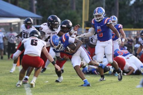Fort White linebacker Carson Lumpkin (17) and defensive back Matthew Pitts gang up to tackle Taylor County quarterback Janez Glanton on Friday. (MORGAN MCMULLEN/Lake City Reporter) 