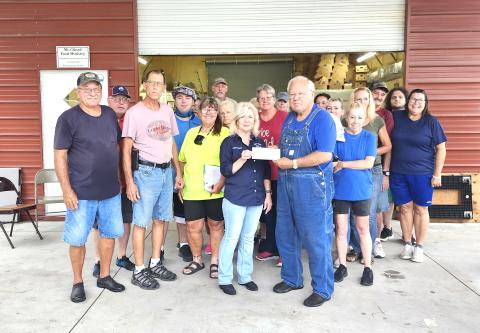 Members of Live Oak Elks Lodge #1165, Lori Watson (Lodge Grant Coordinator), Donald Watson (Past District Deputy) and Cathy Davis (Exalted Ruler) met at the Mt. Gilead Baptist Church Food Ministry in Falmouth on Saturday to present a $,6000 check from the Elks National Foundation Spotlight Grant to Gary Watson, food ministry founder/manager, and his team of volunteers. (COURTESY)