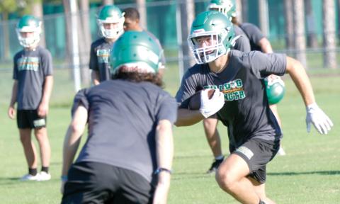 Suwannee receiver Koy Frier runs up the field after a catch during practice on July 28. (JAMIE WACHTER/Lake City Reporter)