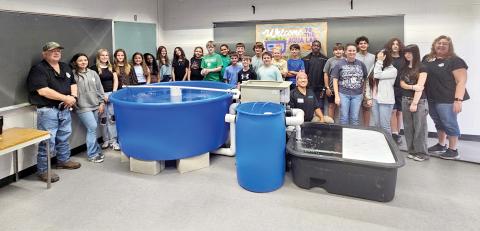 Suwannee Middle School staff and students are pictured after the aquaponics lab was installed for Megan Collins’ homesteading class. (COURTESY)