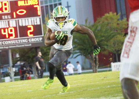 Suwannee running back Lou Jack Smith eyes a hole against Bishop Kenny in the Preseason Classic on Aug. 15. (JAMIE WACHTER/Lake City Reporter)