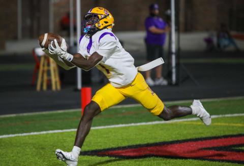 Columbia receiver Kyren Caldwell hauls in a touchdown pass Friday night against Hillsborough. Caldwell had three scoring catches on the night. (BRENT KUYKENDALL/Lake City Reporter)