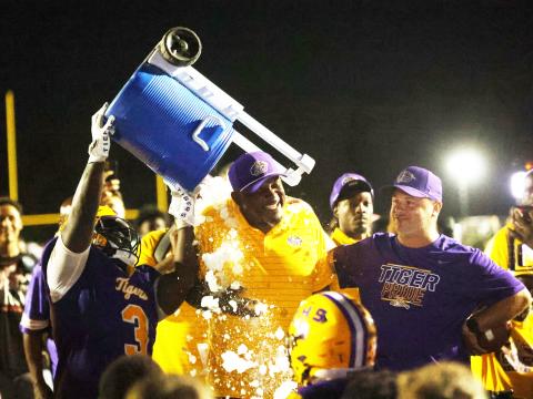 Columbia defensive lineman Terry Henry douses head coach Brian Allen with water after Allen recorded his 100th win. (PAUL BUCHANAN/Lake City Reporter)
