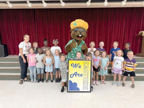 Bellamy Beaver hangs out with students at Eastside Elementary School during his visit Friday to talk about water conservation. (COURTESY)