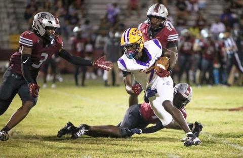 Columbia receiver Kyren Caldwell turns up field after a catch against Madison County last Friday. (BRENT KUYKENDALL/Lake City Reporter)