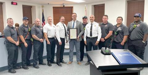 Members of the Lake City Fire Department, including Chief Josh Wehinger and Assistant Chief Rhet Tompkins, receive a proclamation from Mayor Noah Walker at Monday’s Lake City Council meeting for Firefighter Appreciation Month. (COURTESY CITY OF LAKE CITY)