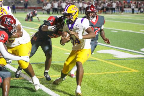 Columbia quarterback Xavier Collins looks for running room during last Friday’s win over Hillsborough. (BRENT KUYKENDALL/Lake City Reporter)