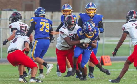 Fort White linebacker Dreyson Lally makes a tackle against Fernandina Beach last Friday. (ASHLEY CHANDLER/Fernandina Beach News-Leader)