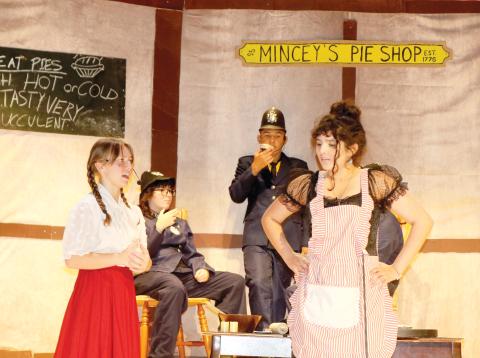 Madisen Bishop (from left) and Elizabeth Villatoro rehearse a scene from Sweeney Todd on Tuesday afternoon at the Fort White Performing Arts Center. The Fort White High School Drama Club is presenting two productions this week. (TONY BRITT/Lake City Reporter)