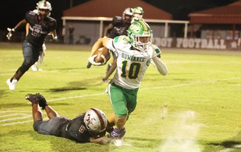 Suwannee receiver Koy Frier is tackled from behind by Madison County defensive end Brandon Williams on Friday. (PAUL BUCHANAN/Lake City Reporter)