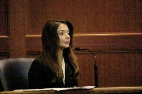 Miss United States Lindsey Langston, a Columbia County resident, sits on the witness stand in a hearing Friday morning at the Columbia County Courthouse. Langston is seeking an injunction for protection from stalking against U.S. Rep. Cory Mills, her former boyfriend. (TONY BRITT/Lake City Reporter)