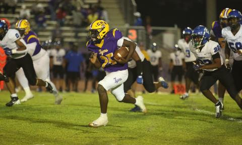 Columbia running back Jerome Horne breaks into the open field against Trinity Christian on Friday. (PAUL BUCHANAN/Lake City Reporter)