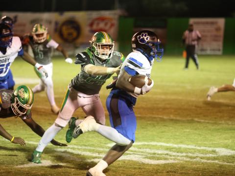 Suwannee defensive end Kyler Watson chases after a Godby ballcarrier during Friday's 36-31 loss. (PAUL BUCHANAN/Lake City Reporter)