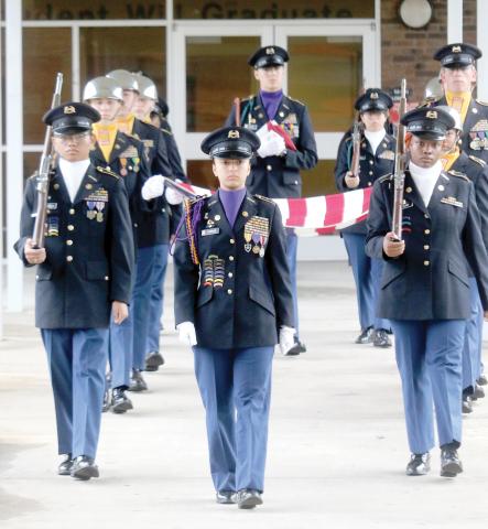 Kiersten Parson (center), then the Columbia High JROTC Battalion Commander, leads the cadets on the annual 9/11 Memorial March at the school last year during Patriot Day.