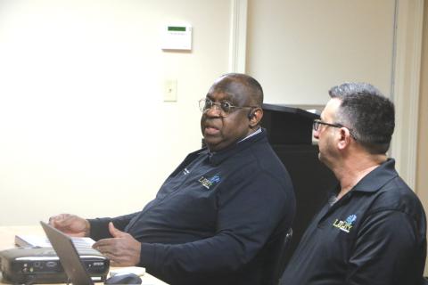 Lake City Manager Don Rosenthal (left) responds to a question during Monday’s Lake Shore Hospital Authority meeting. Rosenthal pitched the city’s plan for 12 vacant lots the Authority is looking to donate. (MORGAN MCMULLEN/Lake City Reporter)