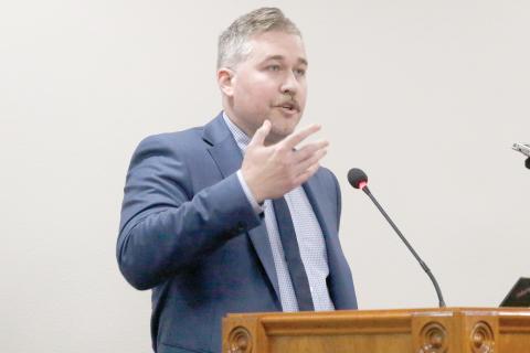 Matthew Ori, a senior consultant with Raftelis, talks to the North Florida Water Utilities Authority board on Wednesday about the status of the rate study being performed by the group. (JAMIE WACHTER/Lake City Reporter)