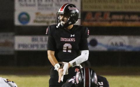Fort White quarterback Matthew Pitts lines up for a snap during Friday’s win over Union County. (MORGAN MCMULLEN/Lake City Reporter)