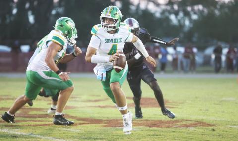 Suwannee quarterback Thomas Sikes scrambles up field against Madison County last Friday. (PAUL BUCHANAN/Lake City Reporter)