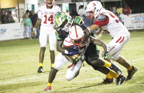 Suwannee defensive lineman Kamari Thompson tackles Hamilton County running back Matthew Berry on Friday. (JAMIE WACHTER/Lake City Reporter)