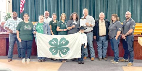 The Columbia County Commission approved a proclamation Thursday declaring Oct. 5-11 as National 4-H Week in Columbia County. Accepting the proclamation were UF/IFAS Columbia County Extension agents and 4-H youth. (JAMIE WACHTER/Lake City Reporter)