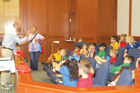 State Attorney for the Third Judicial Circuit John Durrett (left) walks Belmont Academy students through the legal process during a field trip on Thursday. (TONY BRITT/Lake City Reporter)