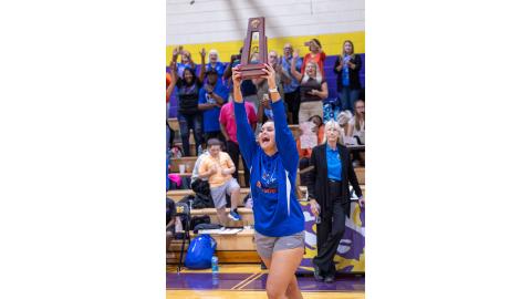 Branford coach Lachelle Sikes celebrates as she delivers the District 6-R trophy to her team following their victory over Union County on Oct. 16. (JACK HOWDESHELL/Lake City Reporter)